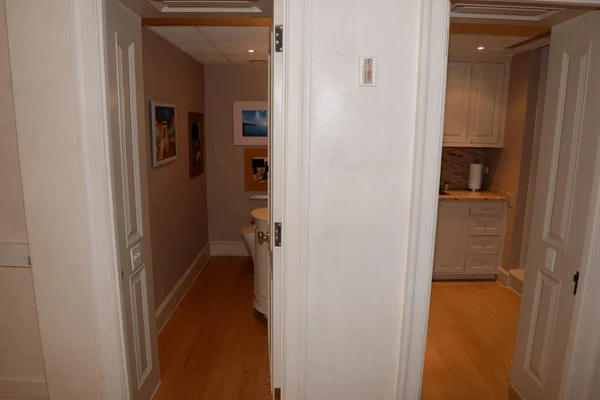 FBI evidence photo showing a hallway and bathroom inside Epstein's estate.