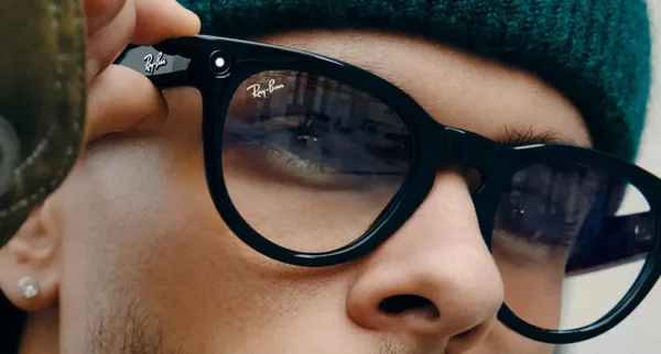 Person wearing Ray-Ban Meta smart glasses outdoors, demonstrating the camera and AI features.
