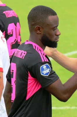 Close-up portrait of Lutsharel Geertruida during a warm-up session in 2022.