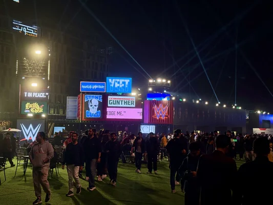 Crowds of fans exploring and interacting in the Royal Rumble 2026 official fan zone.