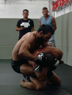 mma fighter doing clinch to another sportsman behind back during wrestling training - Photo, Image