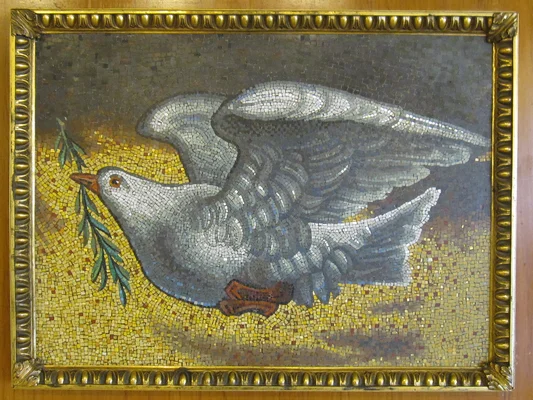 Mosaic of a dove holding an olive branch symbolizing peace
