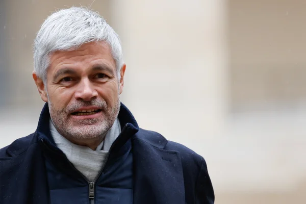 Laurent Wauquiez photographed wearing a dark blue coat and a light gray scarf