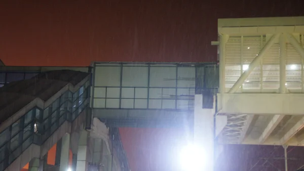 Night view of Yiwu Railway Station glass skybridge under construction.