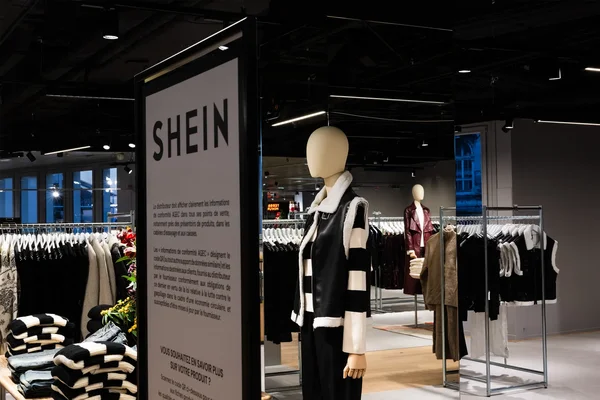 Shein fast fashion Paris store. Image may contain Clothing Coat Adult Person Overcoat and Mannequin