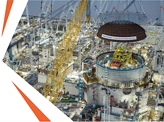 Big Carl has lifted the 245-tonne domed roof onto the first reactor building.