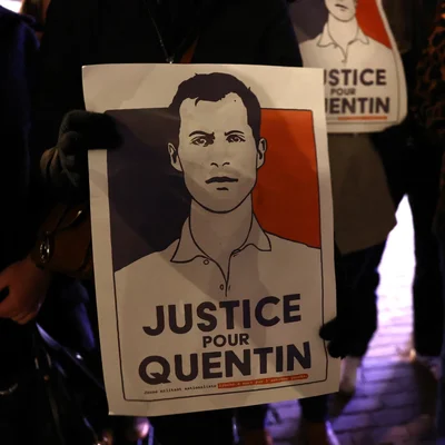 Police officers stand near a cordoned off crime scene in Lyon, France