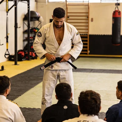 Diego Lopes wearing a gi in a training gym.