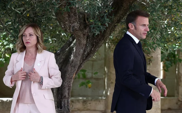 Giorgia Meloni, Emmanuel Macron, and Olaf Scholz during a European summit discussion.