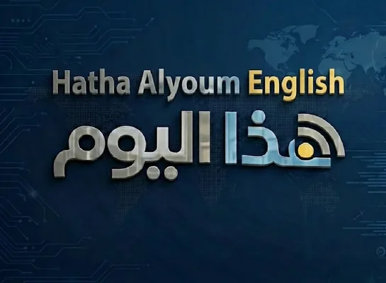 A woman sits at a desk and participates in a video conference with several people via a laptop