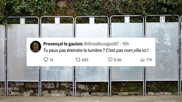 Un groupe de personnes en tenue formelle posant lors d'un événement public avec des drapeaux.