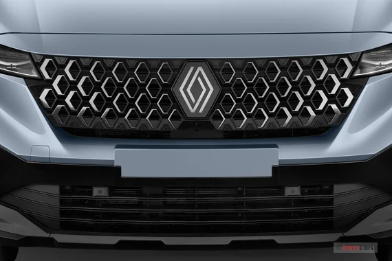 Détail de la calandre avant d'une Renault Espace bleu clair, centrée sur le logo en losange.