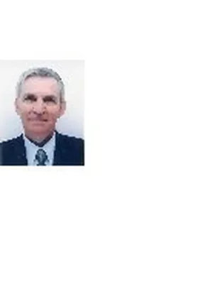 Jean Philippe Molina posant en costume et cravate.