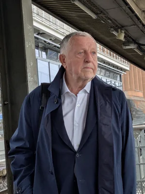 Jean-Michel Aulas photographed on a train station platform.