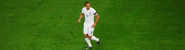 Harry Kane, attaquant de l'équipe nationale d'Angleterre, en action sur la pelouse.