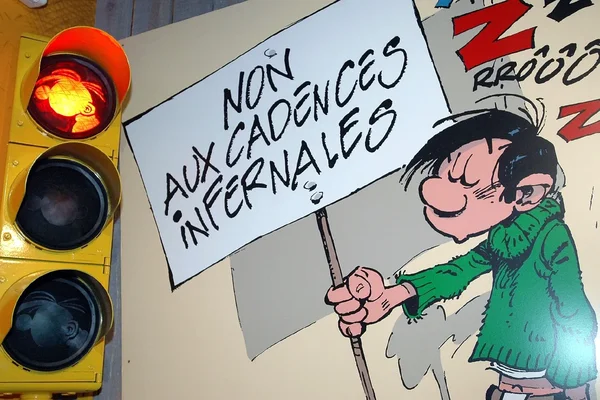 Gaston Lagaffe protestant contre les cadences infernales du travail.