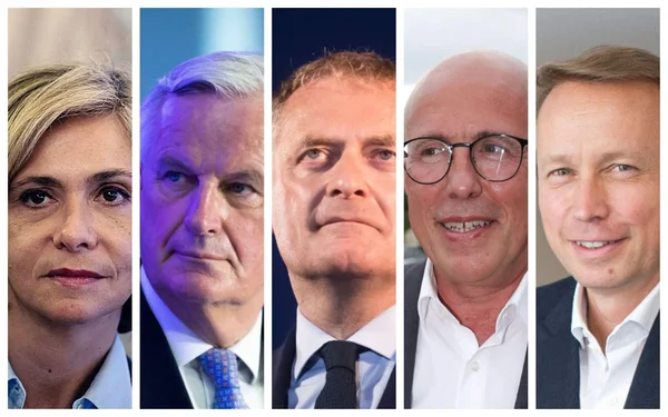 Édouard Philippe, en costume et chemise claire, lors d'un événement intérieur.