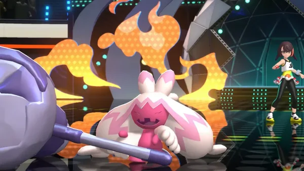 Un personnage en tenue sportif sur une scène lors d'un combat dans Pokémon Champions.