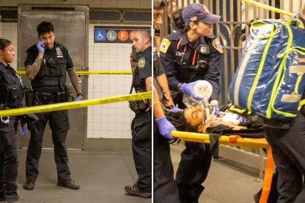 Secourists transportant une victime sur un brancard dans une station de métro new-yorkaise.