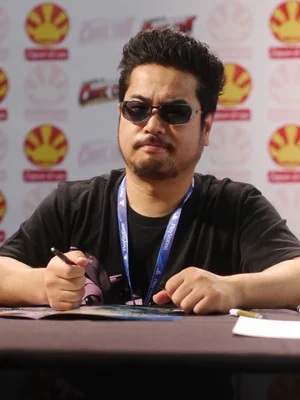Katsuhiro Harada en session de dédicace ou d'entretien.