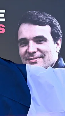 Portrait rapproché de Christophe Gleizes lors d'une audience ou d'un événement.