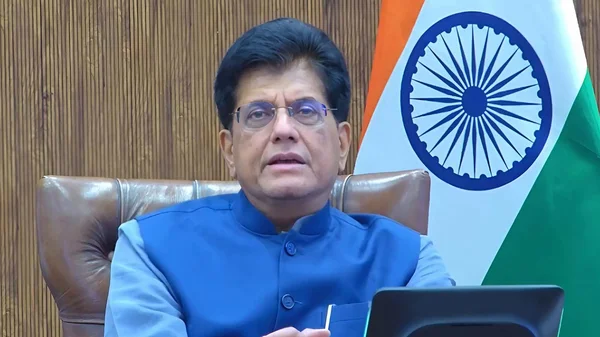 Piyush Goyal dans son bureau, le drapeau indien en arrière-plan.