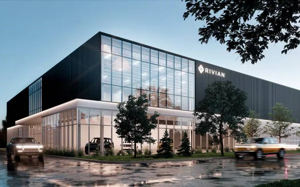 Centre Rivian à Laval, dont l'ouverture est prévue en 2026, illustrant l'expansion de la marque.