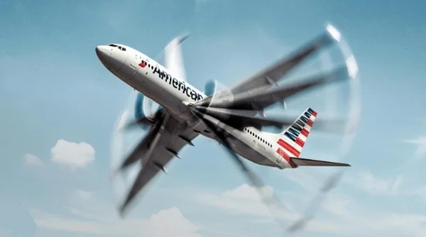 Un avion de ligne d'American Airlines en ascension dans un ciel bleu, les hélices en mouvement.