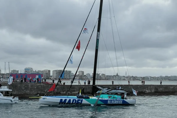 Ambrogio Beccaria, vainqueur de la Vendée Arctique, à la barre de son trimaran 'Allagrande Mapei' dans le port des Sables-d'Olonne.