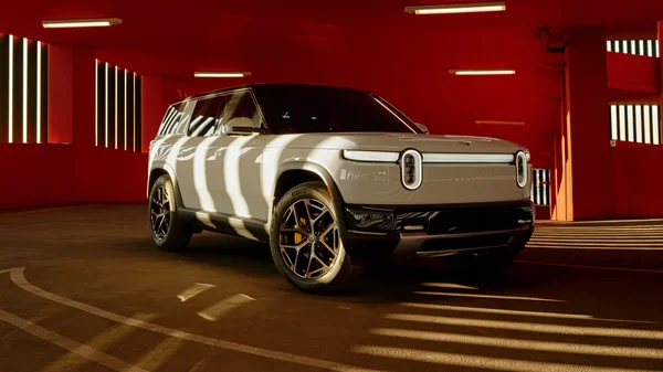 Un Rivian R1S vert devant un bâtiment moderne, illustrant les véhicules produits par l'entreprise.