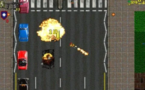 A top-down gameplay screenshot from Grand Theft Auto: London 1961, showing a chaotic street scene with pixelated cars, explosions, and the game's UI elements.