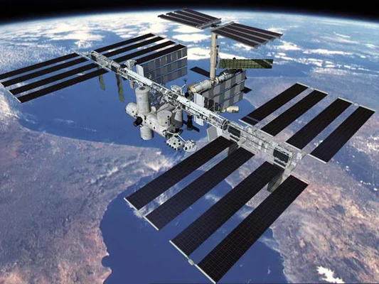 Vue d'artiste de l'ISS en orbite au-dessus de la Terre.