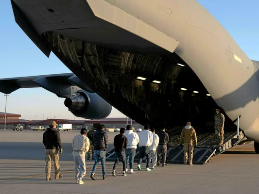 The United States begins deporting illegal migrants by plane.