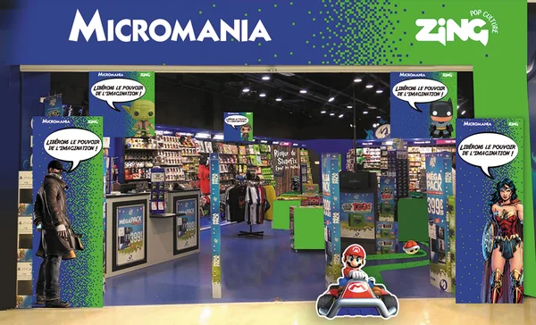 Devanture d'un Micromania ornée de silhouettes de Batman, Wonder Woman et Mario en kart.