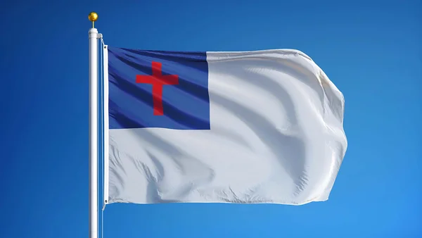 Drapeau chrétien américain flottant contre un ciel bleu.