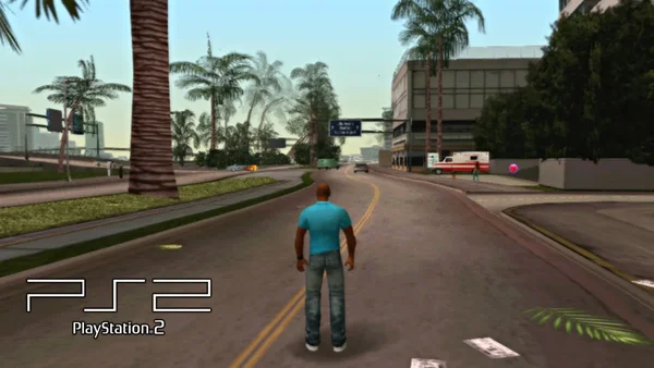 Cette image est une capture d'écran du jeu vidéo Grand Theft Auto: Vice City Stories, sorti en 2006. Elle montre le personnage principal, Victor Vance, marchant sur une route à double sens dans un environnement urbain tropical caractéristique de la ville de Vice City. On y voit des palmiers, des bâtiments modernes et d'autres véhicules. Un logo 'PS2 PlayStation 2' a été ajouté en bas à gauche, indiquant la plateforme de jeu.