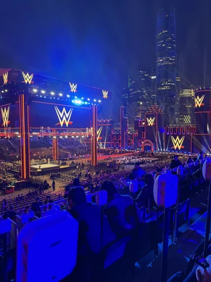 Exterior view of KAFD stadium, the venue for Royal Rumble 2026, illuminated at night.