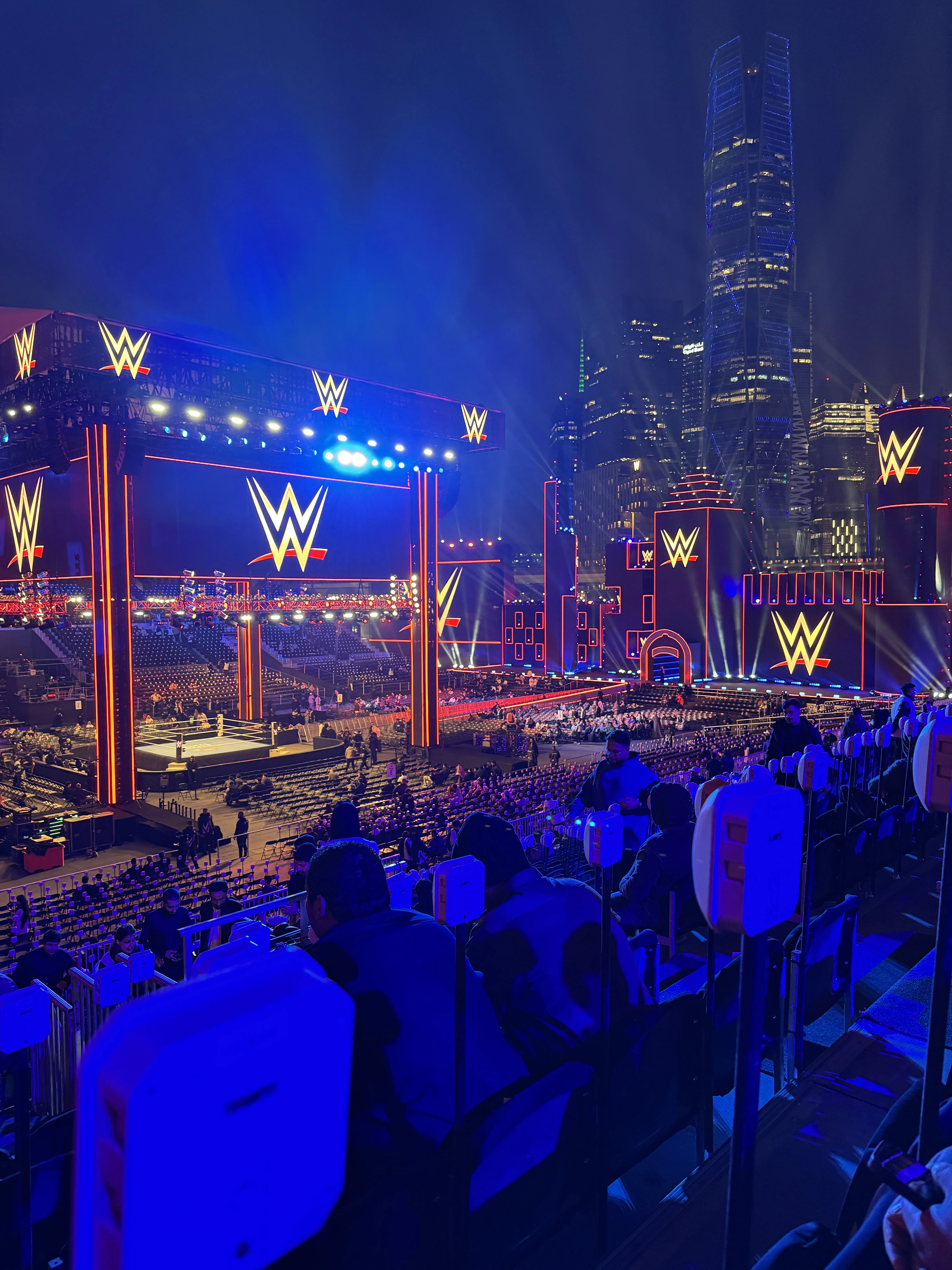 Exterior view of KAFD stadium, the venue for Royal Rumble 2026, illuminated at night.
