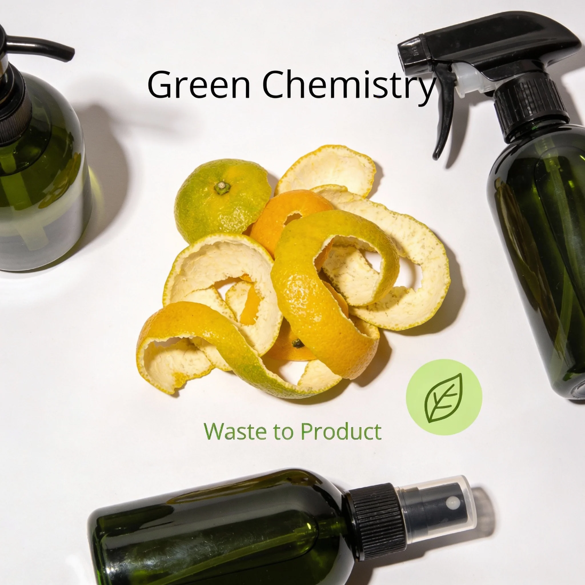 Citrus peels and eco-friendly cleaning products representing green chemistry.