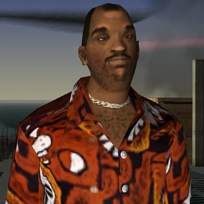Capture d'écran de Grand Theft Auto: Vice City Stories montrant Victor Vance, personnage principal, vêtu d'une chemise à motif orange et d'une chaîne en argent