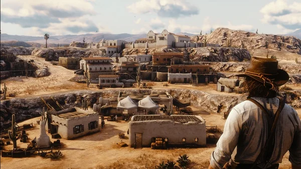 Capture d'écran de gameplay du mod Nuevo Paraiso pour Red Dead Redemption 2 montrant un personnage en chapeau de cowboy surplombant une ville désertique avec ses bâtiments en adobe et ses cactus
