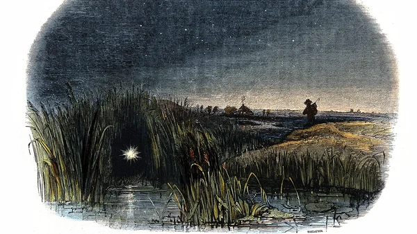 Lueurs fantomatiques de feux follets planant au-dessus d'un marais sombre et brumeux, illustration du phénomène de gaz des marais au méthane expliqué par la science