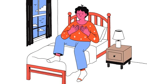 Un jeune adulte assis dans son lit les yeux fermés et les mains sur la poitrine, respirant profondément dans une chambre calme avec une lumière matinale douce entrant par la fenêtre.