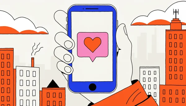 Gros plan sur une main tenant un téléphone avec une bulle de notification montrant un cœur, illustrant l'envoi d'un petit message pour entretenir le lien amical malgré la distance.