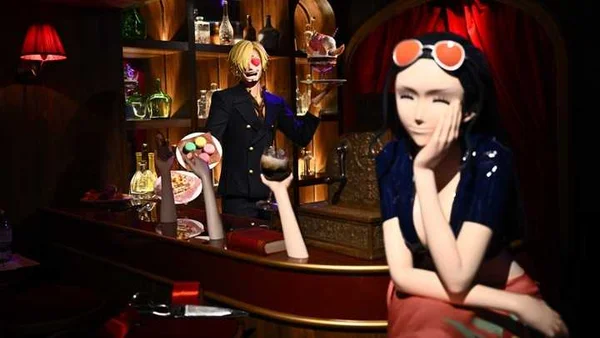 Statues de Sanji et Nico Robin du manga One Piece exposées dans une reconstitution d'une scène de cabaret parisien au Musée Grévin.