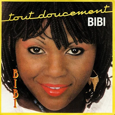 Affiche de Bibie pour le single « Tout Doucement » (1985), montrant un visage proche avec des cheveux tressés, du rouge à lèvres et des boucles dorées, avec le texte 'tout doucement' et 'BIBI'.