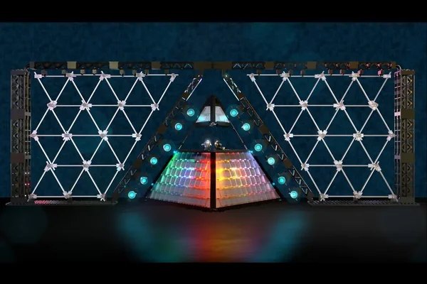 Rendu 3D de la scène pyramidale associée à Daft Punk, avec un écran LED triangulaire central et deux grandes structures lumineuses à grille fixées sur des trusses noirs.