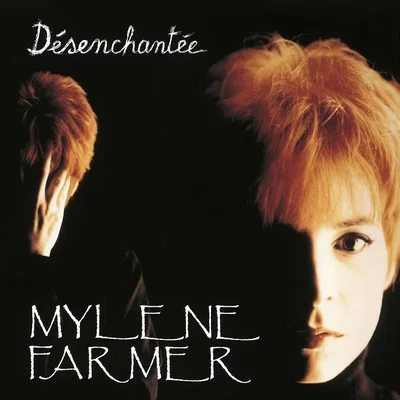 Portrait promotionnel de Mylène Farmer aux cheveux courts roux orangé sur fond noir, avec le titre "Désenchantée" en haut et son nom en bas.