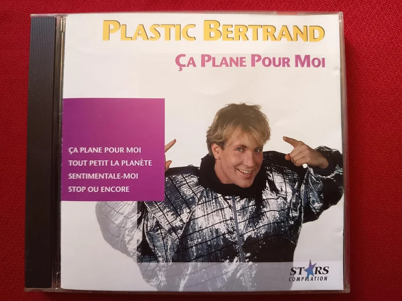 POMME MUSIC - PLASTIC BERTRAND - BEST OF - "CA PLANE POUR MOI" - PLANER - MANUEL - SAC À POUSSIÈRE